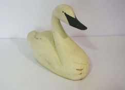 A carved decoy style painted wood swan, together with two decorative waste paper bins, three wall