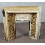 A Victorian cast iron and tiled fire surround, decorated with ivy and flower heads, 97cm high,