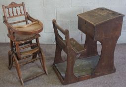 A Vintage childs school desk, early 20th century, with hinged writing desk and integral seat;