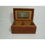 A mahogany humidor box, with hinged lid and two adjustable compartments for cigars, the lid includes