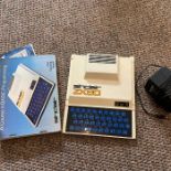 A group of early computing related items, including an Sinclair ZX80 computer, including manual,
