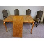 A modern oak veneered draw leaf dining table, with cabriole legs, 77cm high, 150cm long (closed);