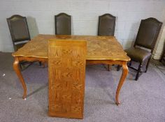 A modern oak veneered draw leaf dining table, with cabriole legs, 77cm high, 150cm long (closed);