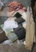 A large assortment of mixed fabric, cushions and curtains (a lot)