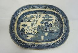 A very large blue and white ‘Willow Pattern’ meat ashet or platter, stamped ‘Best Goode’, 54cm wide;