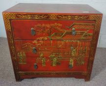A small vintage Chinese style chest of three drawers, 20th century, with red and gilt lacquer