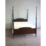 A modern four post double bed, with four turned corner posts, 195cm long, 140cm wide; and a