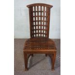 An interesting stained beechwood lattice chair, with bowed pierced back and slatted base, 110cm