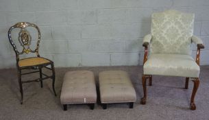 A small Georgian style armchair with leaf capped armrests; with an ebonized side chair and two small