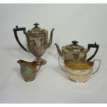 A Victorian silver four piece tea service, hallmarked London 1890, comprising a teapot, hot water