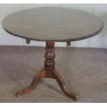 A provincial oak wine table, 19th century, with turned pillar and tripod base, 72cm high, 83cm