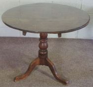 A provincial oak wine table, 19th century, with turned pillar and tripod base, 72cm high, 83cm