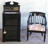 A Regency style ebonized bergere armchair, with bobbin turned back; together with a small