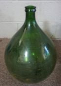 A 19th century large green glass carboy, 35cm diameter; together with another similar and an