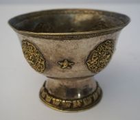 A Chinese silver and silver gilt bowl, 19th century, of waisted form with a Greek key decorated rim,