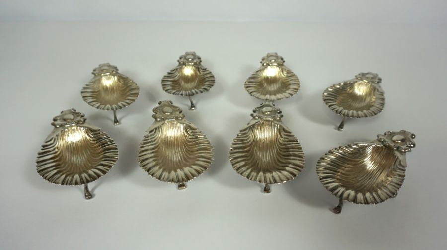 A set of eight Continental silver oyster servers, stamped S. Cipoli, 800, each a shell with scrolled
