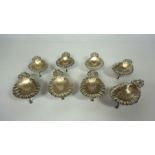 A set of eight Continental silver oyster servers, stamped S. Cipoli, 800, each a shell with scrolled