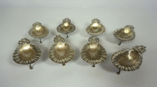 A set of eight Continental silver oyster servers, stamped S. Cipoli, 800, each a shell with scrolled