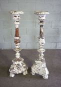 A pair of Renaissance style carved and white washed pricket candlesticks, 120cm high; together