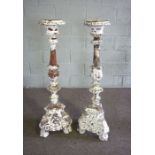 A pair of Renaissance style carved and white washed pricket candlesticks, 120cm high; together