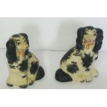 A large assortment of ceramic and glass ornaments, including a pair of Staffordshire Spaniels, three