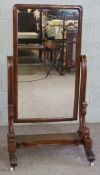 A large Victorian mahogany cheval mirror, circa 1870, with a rounded rectangular tilting plate,