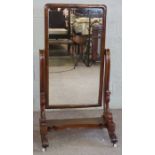 A large Victorian mahogany cheval mirror, circa 1870, with a rounded rectangular tilting plate,