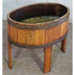 A three tier cake stand with brass supports, together with an oak and brass coopered jardiniere