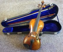 A vintage unnamed violin, with two bows, one stamped ‘Erich Steiner’, the other stamped ‘Japan’, the