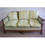 A Colonial style three piece Bergere style suite, including a three seat settee, 79cm high, 164cm
