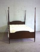 A modern four post double bed, with four turned corner posts, 195cm long, 140cm wide; and a
