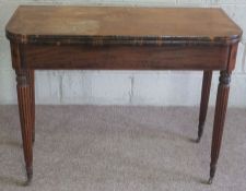 A Regency mahogany tea table, circa 1820, with rounded rectangular fold over top and set on four