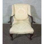 A George II style armchair, 20th century, upholstered in cream, with cabriole legs