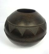 A North African pottery 'Beer' pot, decorated with incised triangular border, base signed Nesta,