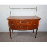 A late Regency mahogany bowfront sideboard, early 19th century, of compact form, with a brass