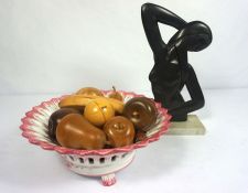 A collection of carved wood fruit and similar objects, in a bowl; together with a modern slate