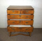 A George I walnut chest on stand, 18th century, with two short and three long graduated drawers, the