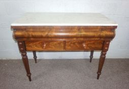 A Victorian mahogany console table, circa 1860, with a rectangular white marble top over an