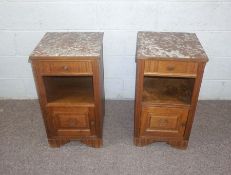 A pair of Art Deco oak bedside cabinets, with Rosso Antico stone tops, over a single drawer, book