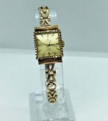 A 'Watches of Switzerland' 18 carat gold cased ladies watch, with 17 Jewel movement, marked WofS,