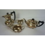 A four silver teaset, hallmarked Birmingham, 1923, comprising a teapot of waisted oval form, a