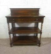 A Jacobean oak buffet, early 20th century, with a gallery back over a drawer and two tiers with