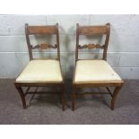 A pair of Regency mahogany bar backed dining chairs; together with a pair of Hepplewhite style