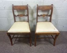 A pair of Regency mahogany bar backed dining chairs; together with a pair of Hepplewhite style