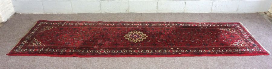 Three rugs, including a Caucasian wool runner, modern, 310cm x 84cm (3)