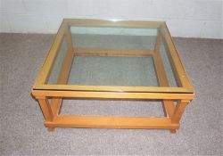 A pair of modern glass and ash framed coffee tables, circa 2000, with clear square tops, and a