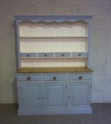 A modern stripped pine and light blue painted dresser, 20th century, with two shelves and small