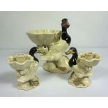 A Fitz & Floyd porcelain figure of a duck, standing beside a lily pad bowl, 26cm high; together with