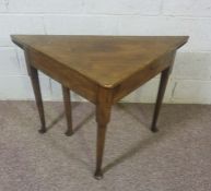 An 18th century provincial walnut envelope side table, with folder over top and concealed