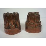 Two 19th century copper jelly moulds, one of lobed form and stamped '10', 14cm high; the other in